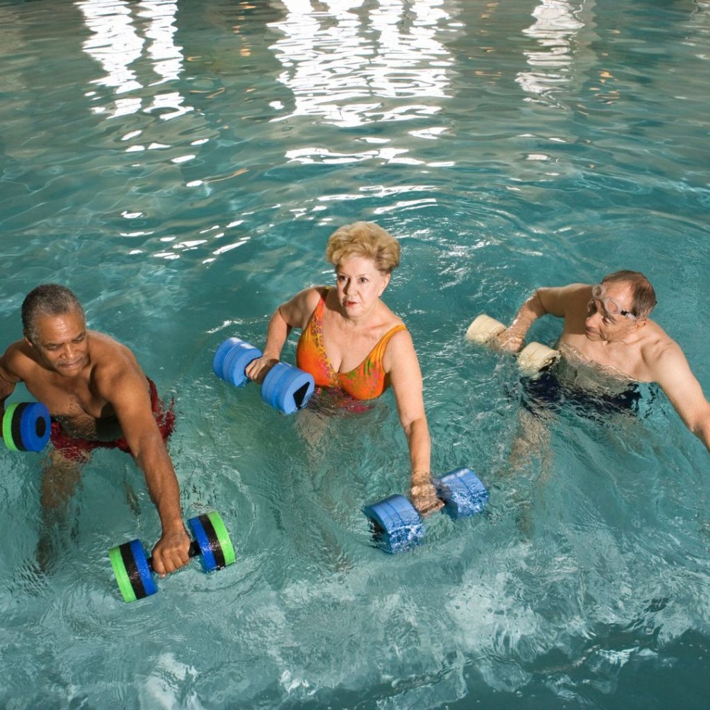 Hydrotherapy Exercises with foam weights in pool.