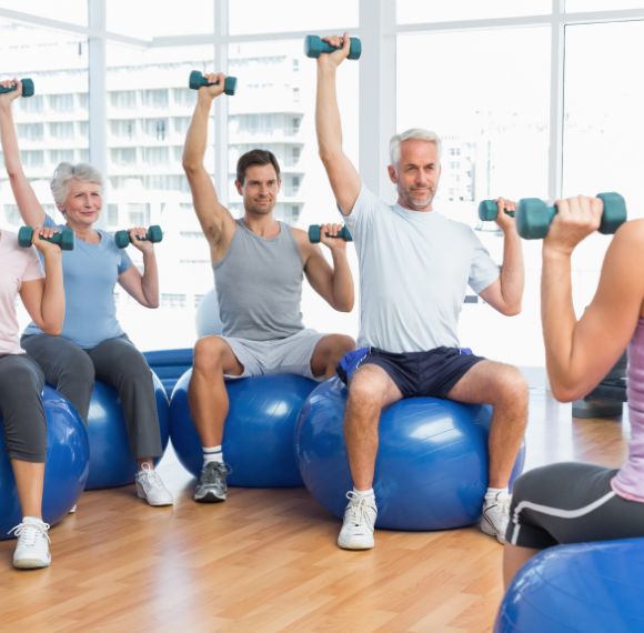 Strength And Conditioning group with weights on balls