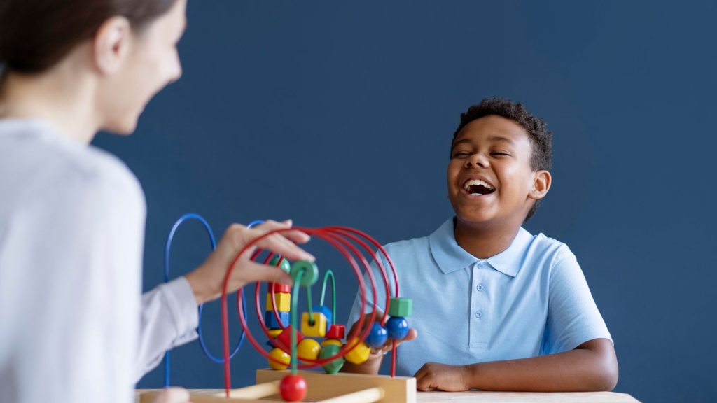 Early intervention: therapist engaging child in playful activity